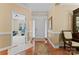 Inviting foyer featuring hardwood floors, a view to living room, and natural light at 536 Wellbourne Nw Ct, Concord, NC 28027