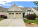 Charming home featuring a two-car garage, manicured lawn, and beautiful landscaping at 536 Wellbourne Nw Ct, Concord, NC 28027
