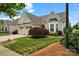 Charming home featuring a two-car garage, manicured lawn, and beautiful landscaping at 536 Wellbourne Nw Ct, Concord, NC 28027