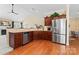 Stylish kitchen with stainless steel appliances, hardwood floors, and plenty of counter space at 536 Wellbourne Nw Ct, Concord, NC 28027