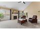 Comfortable living room featuring a fireplace, plush seating and large windows with views at 536 Wellbourne Nw Ct, Concord, NC 28027