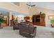 Cozy living room with a vaulted ceiling features a media center and bar height counter at 536 Wellbourne Nw Ct, Concord, NC 28027