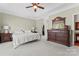 Spacious main bedroom features a tray ceiling, plush carpet, and a dressing table at 536 Wellbourne Nw Ct, Concord, NC 28027