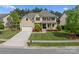 An elevated shot of a 2 story home, green lawn, attractive landscaping, and a 2 car garage at 541 Nw Sutro Forest Dr, Concord, NC 28027