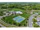Overhead view showcasing community amenities, including tennis courts, pool, clubhouse, and playground at 541 Nw Sutro Forest Dr, Concord, NC 28027