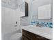 Bathroom features a shower-tub combo, modern fixtures, and blue tile detail at 541 Nw Sutro Forest Dr, Concord, NC 28027