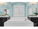Bright bathroom featuring dual vanities, a soaking tub, and natural light at 541 Nw Sutro Forest Dr, Concord, NC 28027