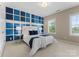 Bedroom with custom blue wall decorations, carpeted floor, and natural light at 541 Nw Sutro Forest Dr, Concord, NC 28027