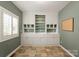 Dedicated craft room offering ample storage, built-in shelving, and natural light at 541 Nw Sutro Forest Dr, Concord, NC 28027