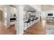 Bright kitchen with white cabinetry, stainless steel appliances, and a breakfast bar with seating at 541 Nw Sutro Forest Dr, Concord, NC 28027