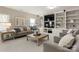 Cozy living room with stylish seating, built-in shelving, and a large TV at 541 Nw Sutro Forest Dr, Concord, NC 28027