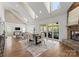 Spacious living room with a fireplace, skylights, and sliding doors to outdoor space at 541 Nw Sutro Forest Dr, Concord, NC 28027