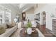 Open-concept living space featuring a fireplace, access to dining area and kitchen at 541 Nw Sutro Forest Dr, Concord, NC 28027