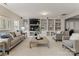 Spacious living room boasting built-in shelving, neutral decor, and comfortable seating at 541 Nw Sutro Forest Dr, Concord, NC 28027