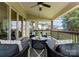 Covered back patio featuring comfortable seating and a view of the backyard at 541 Nw Sutro Forest Dr, Concord, NC 28027