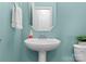 Charming powder room with pedestal sink, mirror, and toilet at 541 Nw Sutro Forest Dr, Concord, NC 28027