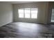 Sunlit living room with new flooring and neutral colors, perfect for relaxation at 574 30Th Avenue Ne Cir, Hickory, NC 28601