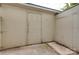 Enclosed back porch with painted walls, door, and concrete flooring at 5901 Quail Hollow Rd # G, Charlotte, NC 28210