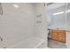 Newly renovated full bathroom featuring a tub shower with a tile surround and modern fixtures at 5901 Quail Hollow Rd # G, Charlotte, NC 28210