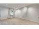 Bright room with neutral walls, track lighting, and wood-look flooring at 5901 Quail Hollow Rd # G, Charlotte, NC 28210