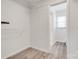 Walk-in closet featuring ample shelving and access to a full bathroom at 5901 Quail Hollow Rd # G, Charlotte, NC 28210