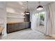 Dining area featuring built-in cabinets, sliding door to patio, and modern pendant lights at 5901 Quail Hollow Rd # G, Charlotte, NC 28210