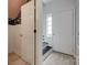 Bright entryway with wood floors, white doors, and stairs at 5901 Quail Hollow Rd # G, Charlotte, NC 28210