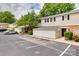 Townhome exterior with parking lot, landscaped walkway, and private entrance at 5901 Quail Hollow Rd # G, Charlotte, NC 28210