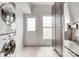 Laundry area with stacked washer/dryer next to storage and door to the outside at 5901 Quail Hollow Rd # G, Charlotte, NC 28210