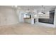 Open living area with wood-look floors and views to the kitchen at 5901 Quail Hollow Rd # G, Charlotte, NC 28210