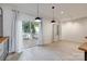 Bright living area with wood-look floors and sliding doors to patio at 5901 Quail Hollow Rd # G, Charlotte, NC 28210