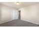 Neutral bedroom featuring carpeted floors and a double door closet for optimal storage space at 6153 Kilchurn Dr, Fort Mill, SC 29707