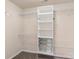 Walk-in closet featuring shelving units and ample storage solutions on top of neutral-colored carpeting at 6153 Kilchurn Dr, Fort Mill, SC 29707