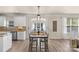 Dining area with modern table and chairs, bright windows, and tile backsplash at 6153 Kilchurn Dr, Fort Mill, SC 29707