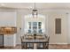 Cozy dining space featuring a window seat and place settings at the wooden table at 6153 Kilchurn Dr, Fort Mill, SC 29707