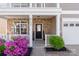 Charming front entrance with stone accents, tidy landscaping, and a welcoming porch creates an inviting first impression at 6153 Kilchurn Dr, Fort Mill, SC 29707