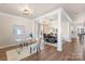 Open-concept living areas feature modern lighting and elegant architectural details for flexible living and entertaining at 6153 Kilchurn Dr, Fort Mill, SC 29707