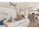 Bright living room with an open floor plan, seamlessly connecting the living area, dining space, and kitchen at 6153 Kilchurn Dr, Fort Mill, SC 29707