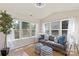 Bright sunroom with neutral tones, multiple windows, and comfortable seating for relaxation and enjoyment of natural light at 6153 Kilchurn Dr, Fort Mill, SC 29707