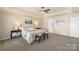 Inviting main bedroom with a neutral color scheme, tray ceiling, and soft lighting for a relaxing retreat at 6153 Kilchurn Dr, Fort Mill, SC 29707