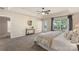 Tranquil main bedroom featuring soft tones, a tray ceiling, and a private door to the outdoor for a peaceful escape at 6153 Kilchurn Dr, Fort Mill, SC 29707