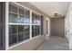 Front porch featuring large windows and neutral siding for a great first impression at 6153 Kilchurn Dr, Fort Mill, SC 29707