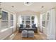 Bright sunroom with large windows, comfortable seating, and natural light at 6153 Kilchurn Dr, Fort Mill, SC 29707