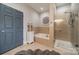 Bathroom with bathtub and glass enclosed shower at 637 Williamson Rd # 309, Mooresville, NC 28117