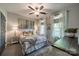 Charming bedroom featuring a ceiling fan, stylish decor, and ample natural light at 637 Williamson Rd # 309, Mooresville, NC 28117