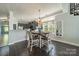 Bright dining area features stylish table, chairs, and large window at 637 Williamson Rd # 309, Mooresville, NC 28117