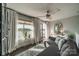 Relaxing living room with water views, neutral tones, fan and ample natural light at 637 Williamson Rd # 309, Mooresville, NC 28117