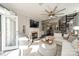 Bright living room with fireplace and stairs at 637 Williamson Rd # 309, Mooresville, NC 28117