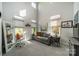 Bright living room with high ceilings, many windows, and comfortable seating arrangements at 637 Williamson Rd # 309, Mooresville, NC 28117