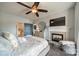 Spacious primary bedroom with fireplace and ceiling fan at 637 Williamson Rd # 309, Mooresville, NC 28117